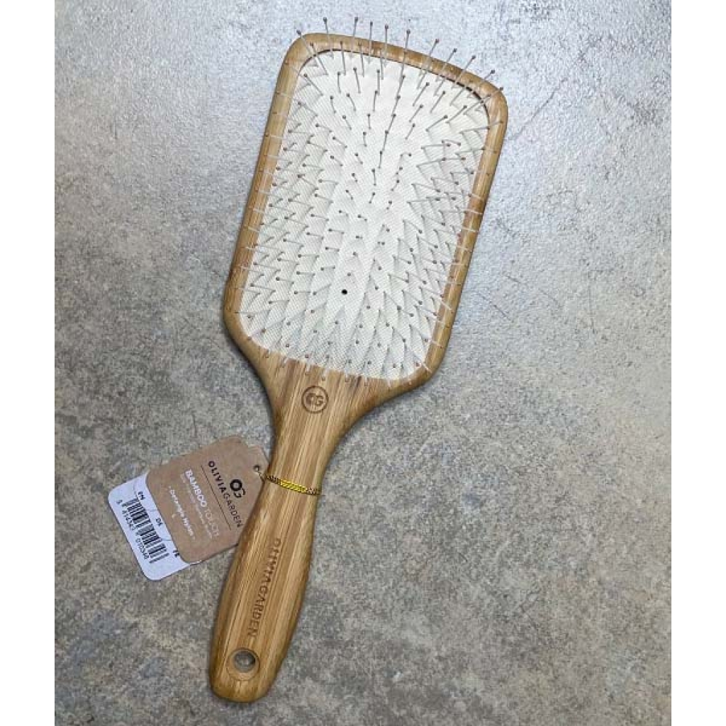 An Olivia Garden – Ionic Bambus hårbørste Detangle Nylon L - Padlebørste med et mærke på.