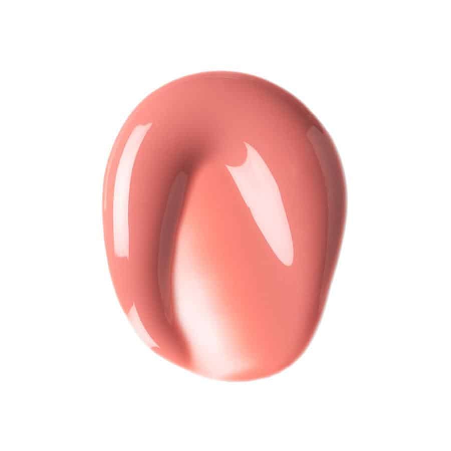 et nærbillede af en pink neglelak på en hvid baggrund.