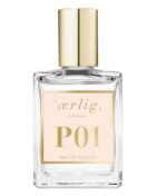 En flaske Ærlig P01 – Eau de Parfum 15 ml glasflaske spray REJSE på hvid baggrund.