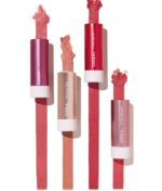 Fire rør COOLA Mineral Liplux® SPF30 - Nude Beach i nuancer af pink og rosa er vist med farveprøver af hver farve, der strækker sig fra toppen af rørene.