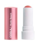 En pink-farvet COOLA Mineral Liplux® SPF30 - Nude Beach tube med hætten af, der viser den koralfarvede balsamstick.