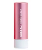 En pink og hvid COOLA Mineral Liplux® SPF30 - Nude Beach tube med "Nude Beach" skrevet på.