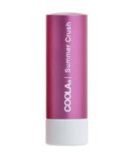 Et pink cylindrisk rør af COOLA Mineral Liplux® SPF30 - Summer Crush med en hvid base.