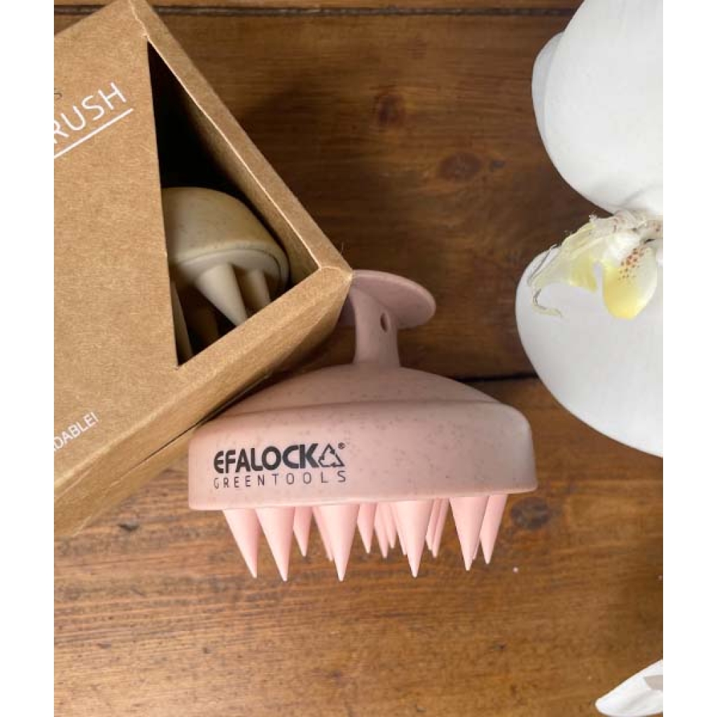 En EFALOCK Shampoo Brush Rose - 100% hvedestrå plastik blomst i en æske ved siden af et træbord.