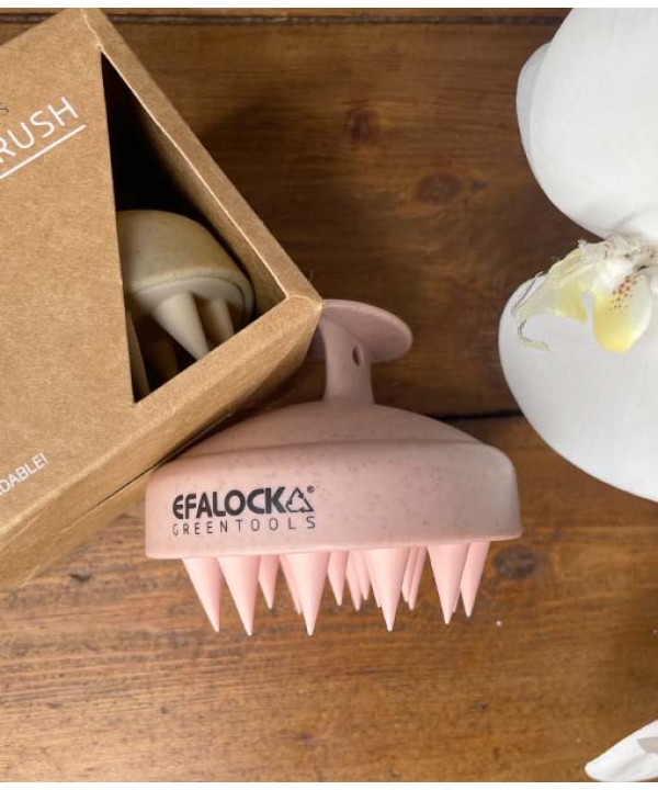 En EFALOCK Shampoo Brush Rose - 100% hvedestrå plastik blomst i en æske ved siden af et træbord.