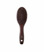 John Masters Organics Combo Paddle Brush - Mini er en brun hårbørste med et ovalt hoved og børstehår, med et hul i håndtaget til ophængning.