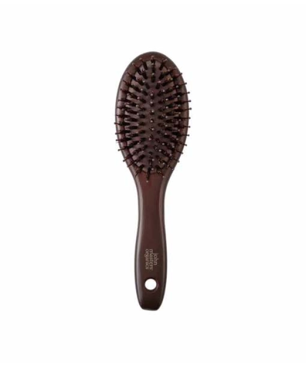 John Masters Organics Combo Paddle Brush - Mini er en brun hårbørste med et ovalt hoved og børstehår, med et hul i håndtaget til ophængning.